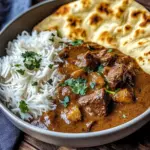 Slow-Cooked Beef Curry in Coconut Gravy with Toasted Garlic Naan